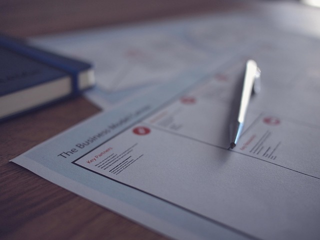 farm owner reviewing production plan and financial forecast documents